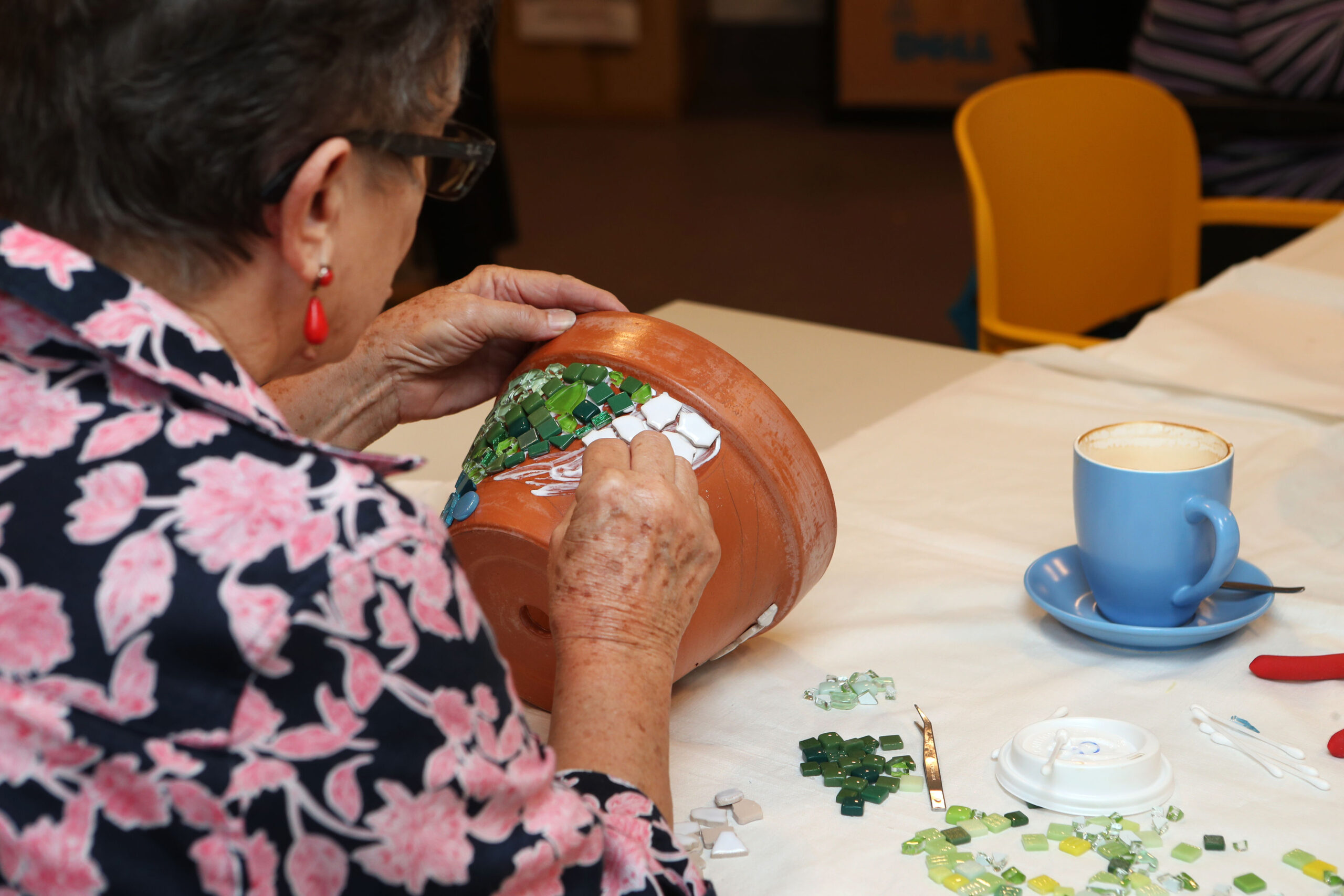 Warrigal residents showcasing creativity in an engaging arts and crafts activity.