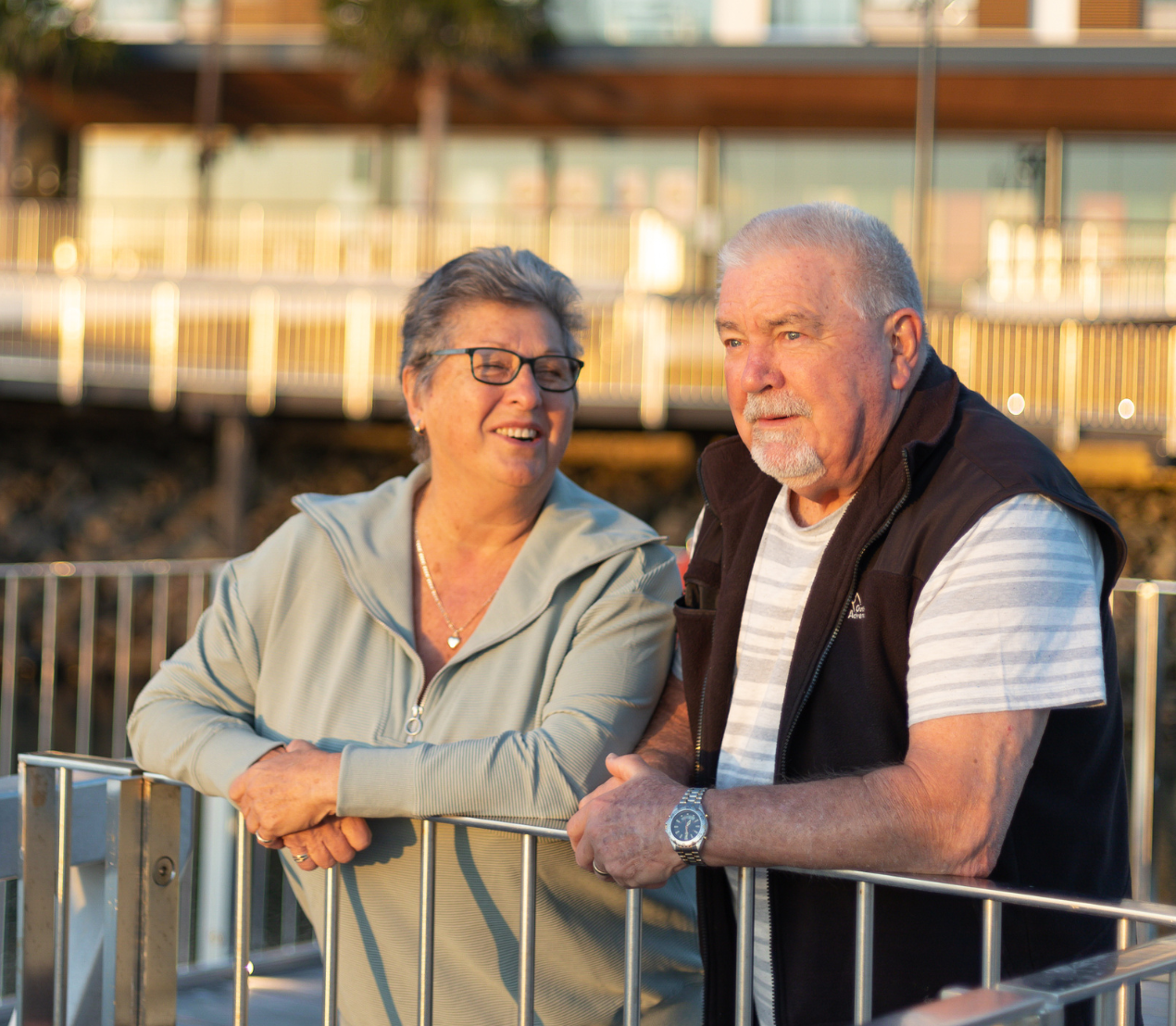 Warrigal Shell Cove village residents smile together at sunrise