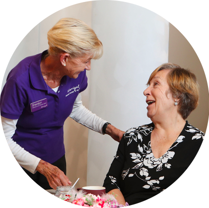 Friendly interaction between a Warrigal staff member and a resident.